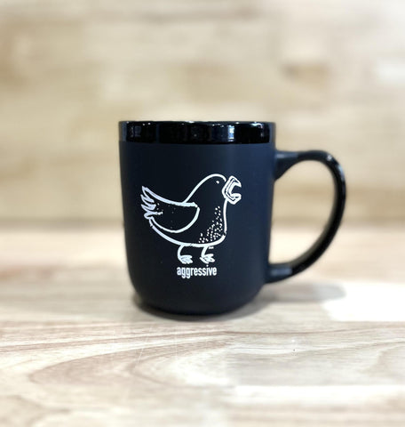 Aggressive White on Black Mug by Ande Lynch