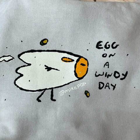 Egg on a Windy Day Hoodie @mikepop